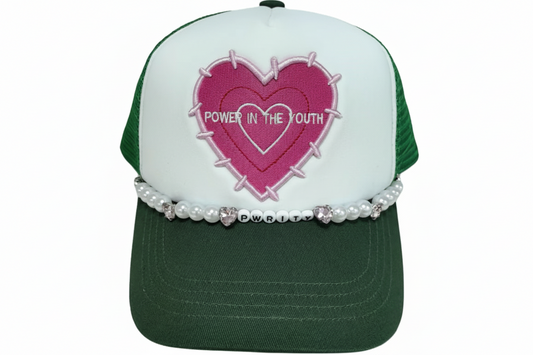 Green and white cap with pink heart design and 'Power in the Youth' text, decorated with pearls.